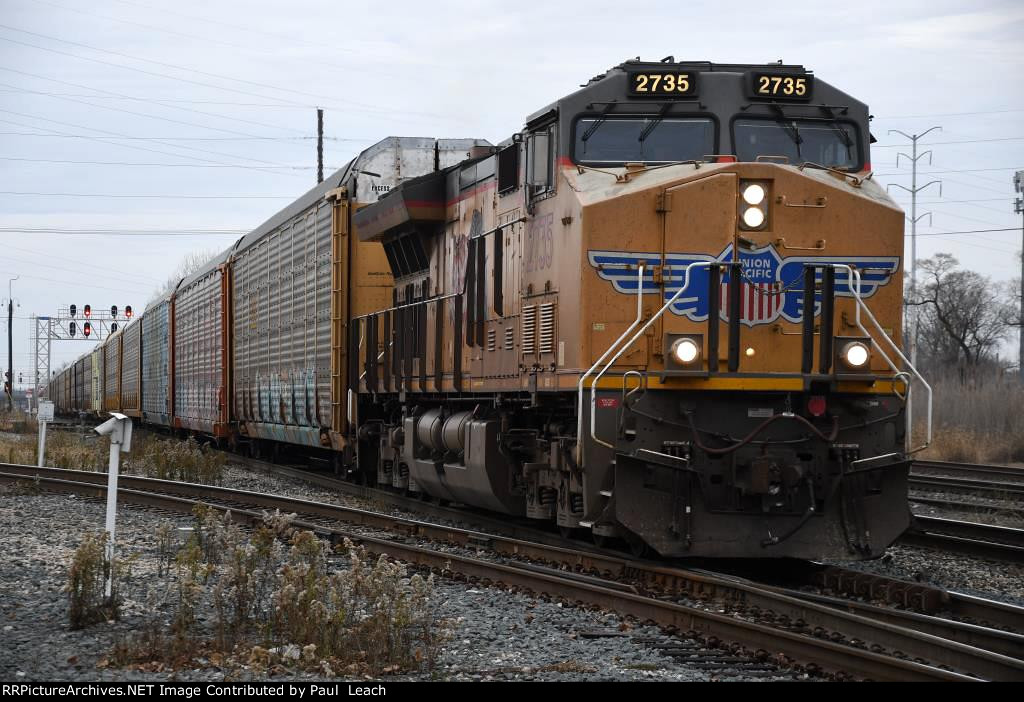 Eastbound vehicle train comes over the diamonds